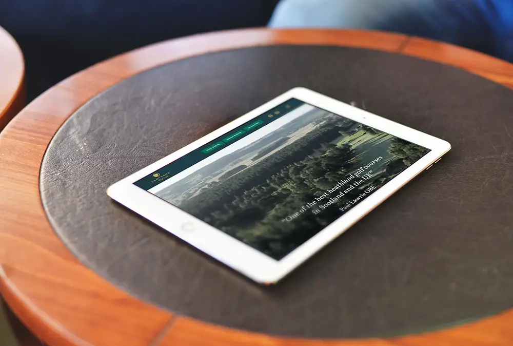 Ladybank Golf Club website – tablet view Tablet resting on a table displaying the Ladybank Golf Club website