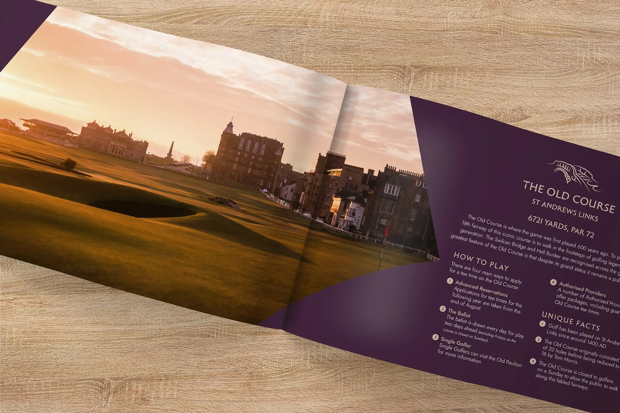 The Old Course brochure designed for St Andrews Links Trust, laid on a wooden surface