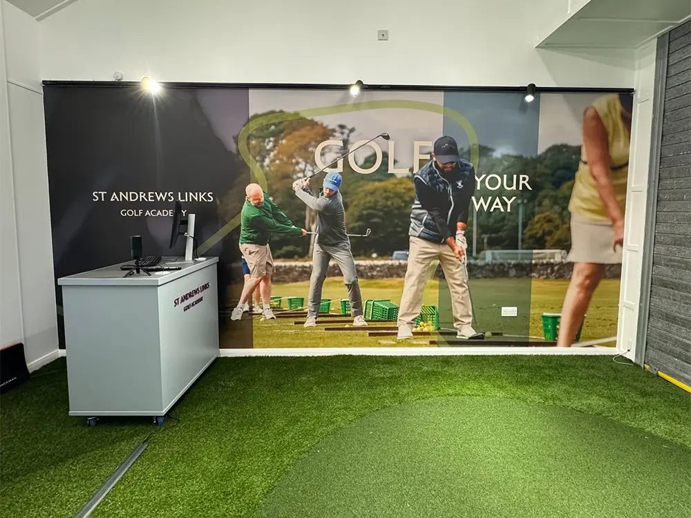 St Andrews Links Golf Academy reception desk with branded display graphics