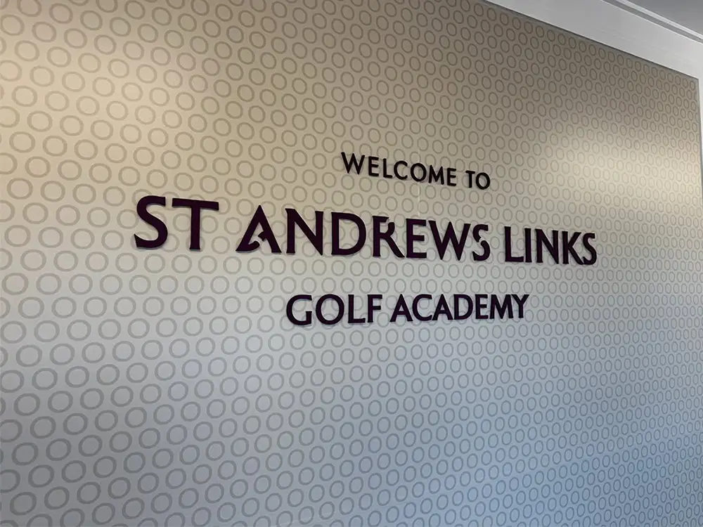 St Andrews Links Golf Academy welcome signage on an interior wall